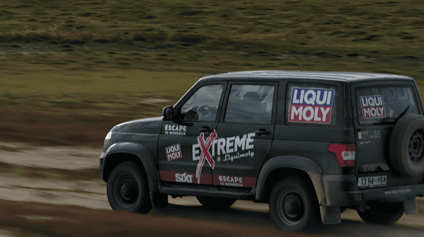 A car driving on a two week offroad Mongolia tour